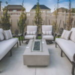 Athens Furniture Set on a concrete patio with a fire pit table