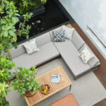 Magic Box sectional aerial view on a patio with a tree